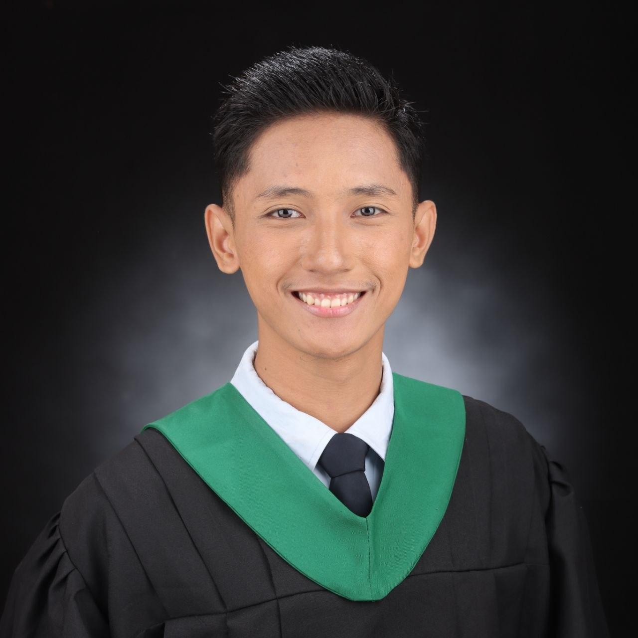 JM Lahorra portrait in graduation toga